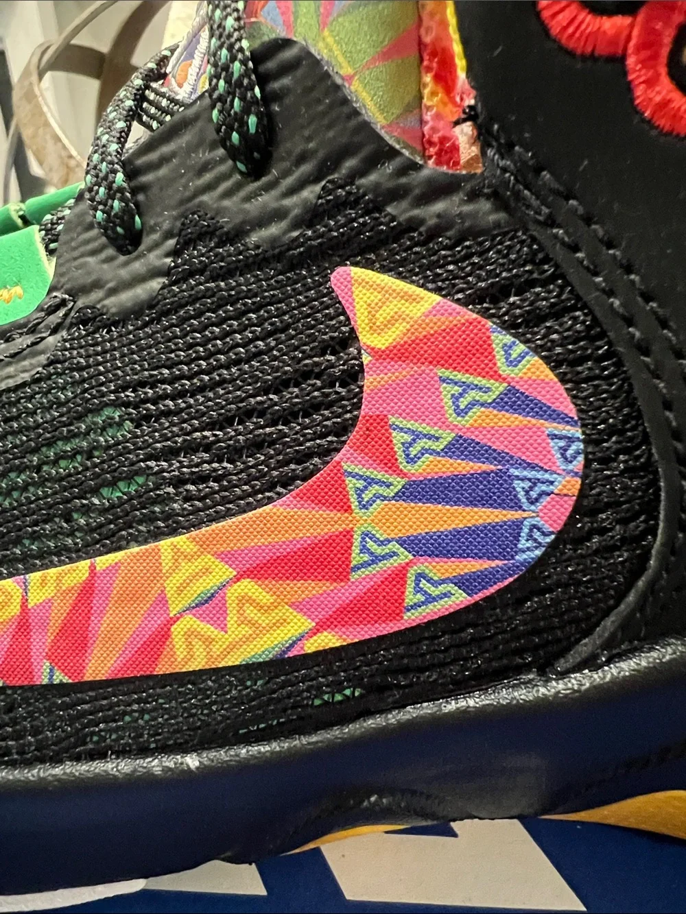 Nike Kids Black Sneakers with Yellow Accents and Multicolor Swoosh